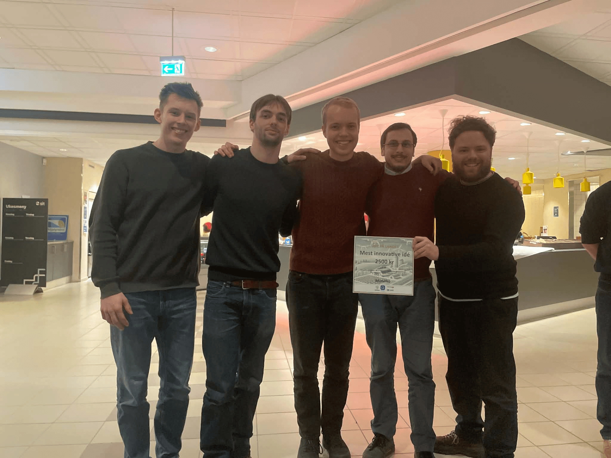 The team holding the innovation prize certificate at the IES & ELSYS Innovation Competition